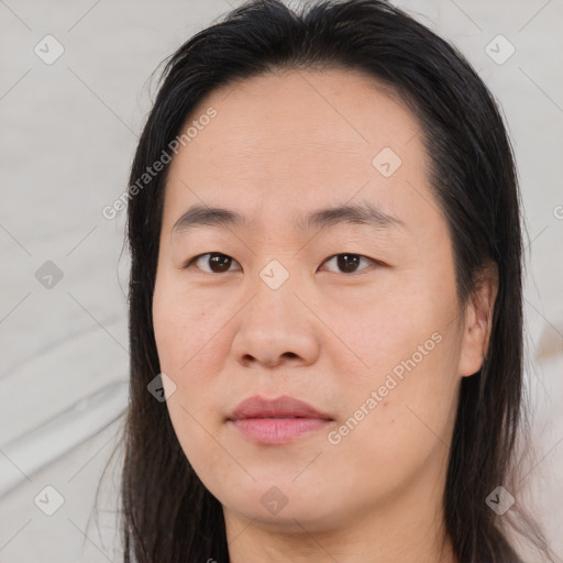 Joyful asian young-adult female with long  brown hair and brown eyes