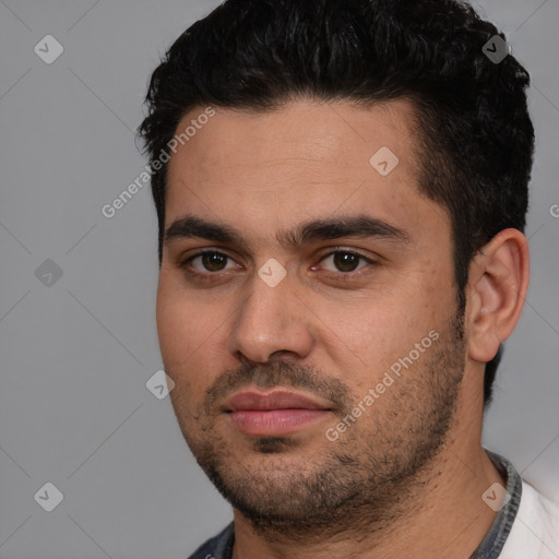 Joyful white young-adult male with short  black hair and brown eyes