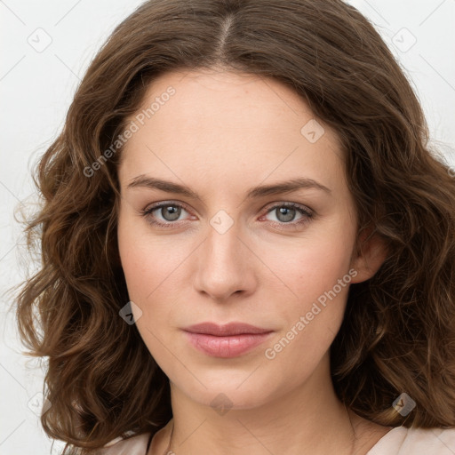 Joyful white young-adult female with long  brown hair and green eyes