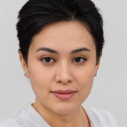 Joyful asian young-adult female with short  brown hair and brown eyes