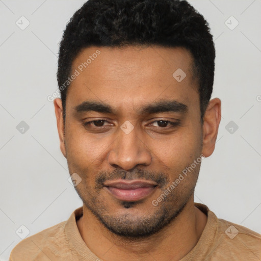Joyful latino young-adult male with short  black hair and brown eyes