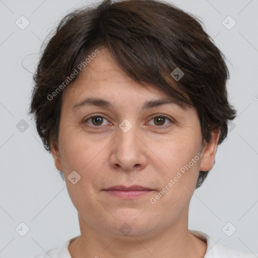 Joyful white adult female with short  brown hair and brown eyes