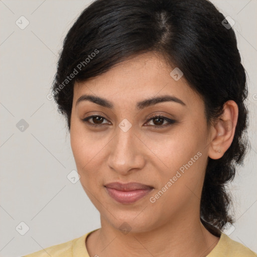 Joyful latino young-adult female with medium  brown hair and brown eyes