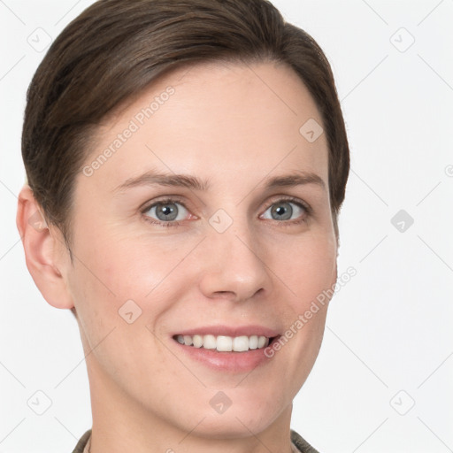 Joyful white young-adult female with short  brown hair and grey eyes