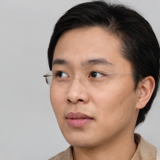 Neutral asian young-adult male with short  brown hair and brown eyes