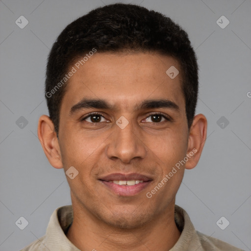 Joyful latino young-adult male with short  brown hair and brown eyes