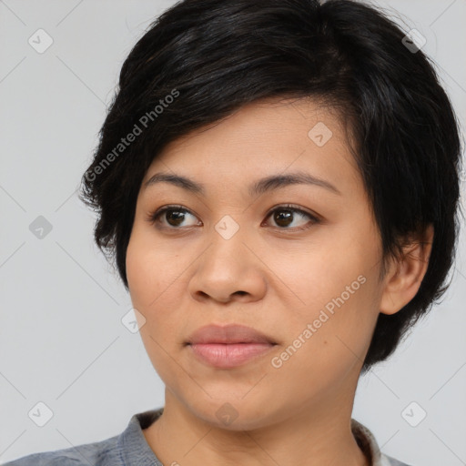 Joyful asian young-adult female with medium  black hair and brown eyes