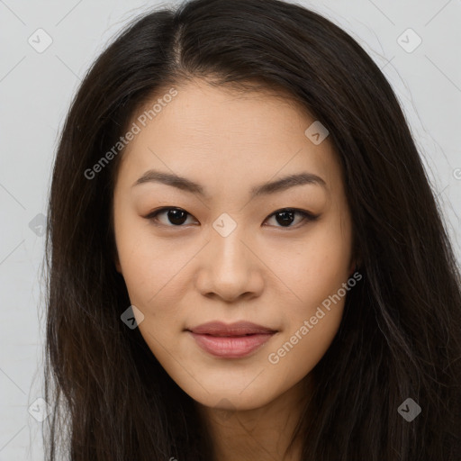 Joyful asian young-adult female with long  brown hair and brown eyes