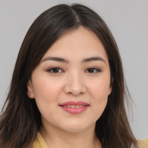 Joyful white young-adult female with long  brown hair and brown eyes