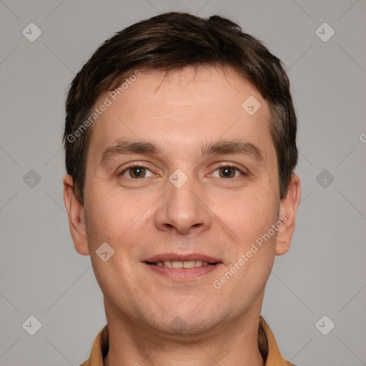 Joyful white adult male with short  brown hair and brown eyes