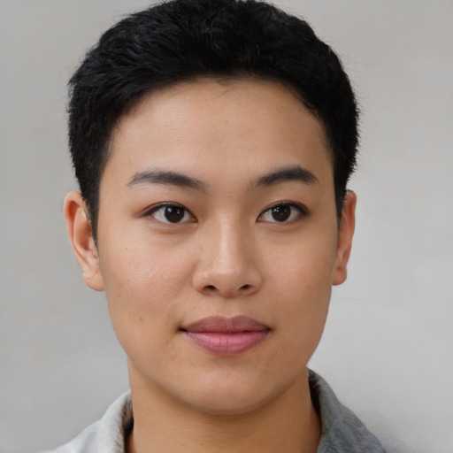 Joyful asian young-adult female with short  black hair and brown eyes
