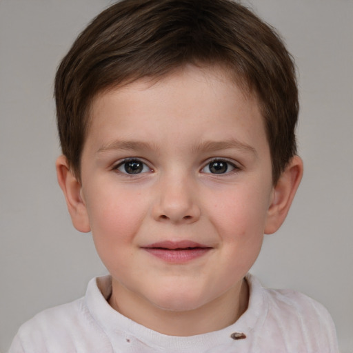 Joyful white child male with short  brown hair and brown eyes