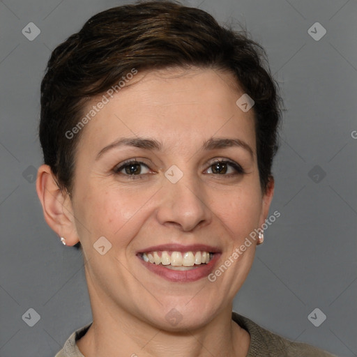 Joyful white adult female with short  brown hair and grey eyes