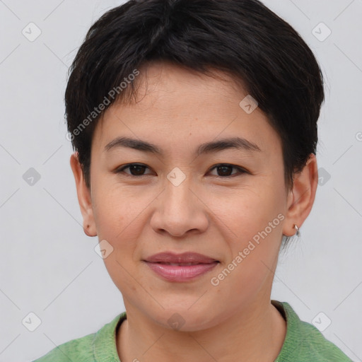 Joyful asian young-adult female with short  brown hair and brown eyes