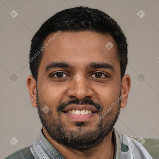 Joyful black young-adult male with short  black hair and brown eyes