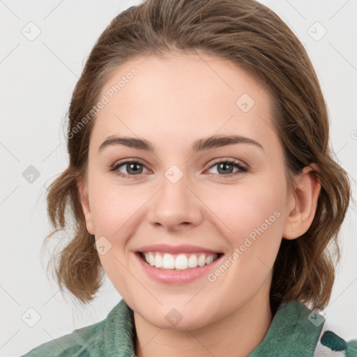 Joyful white young-adult female with medium  brown hair and green eyes