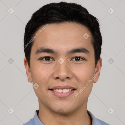 Joyful white young-adult male with short  black hair and brown eyes