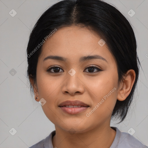 Joyful latino young-adult female with medium  black hair and brown eyes