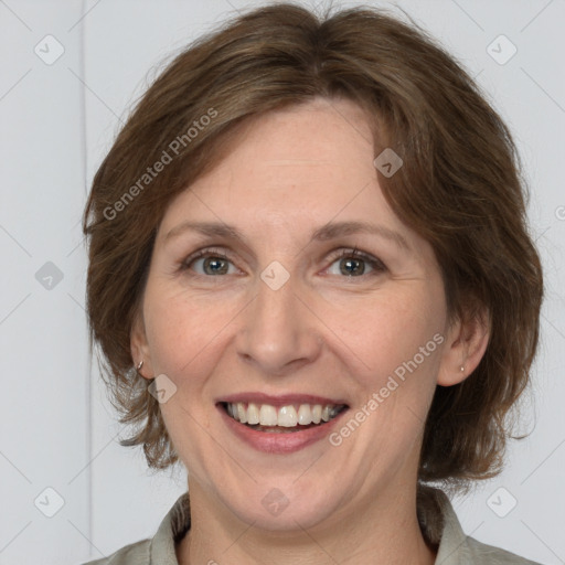 Joyful white adult female with medium  brown hair and grey eyes