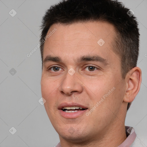 Joyful white young-adult male with short  brown hair and brown eyes