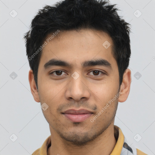 Joyful latino young-adult male with short  black hair and brown eyes