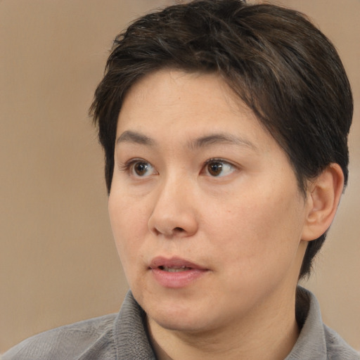 Neutral white adult female with short  brown hair and brown eyes