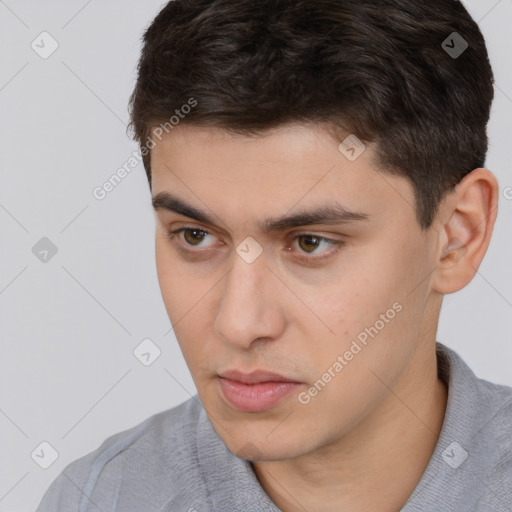 Neutral white young-adult male with short  brown hair and brown eyes