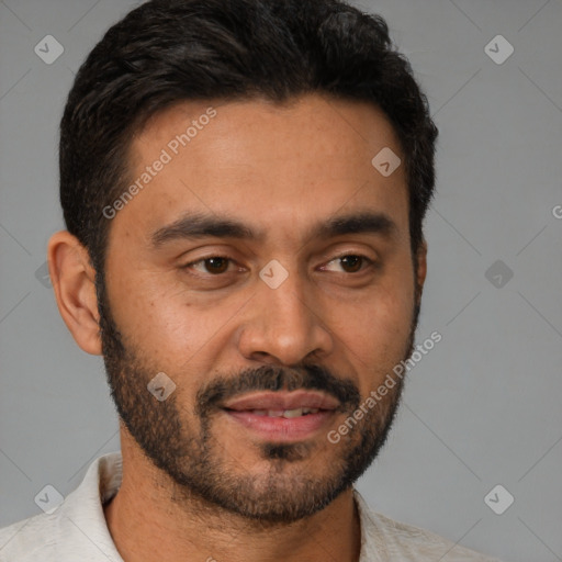 Joyful latino young-adult male with short  brown hair and brown eyes