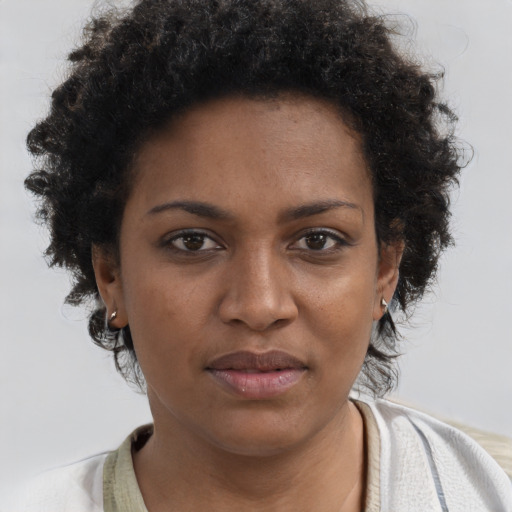 Neutral black young-adult female with short  brown hair and brown eyes