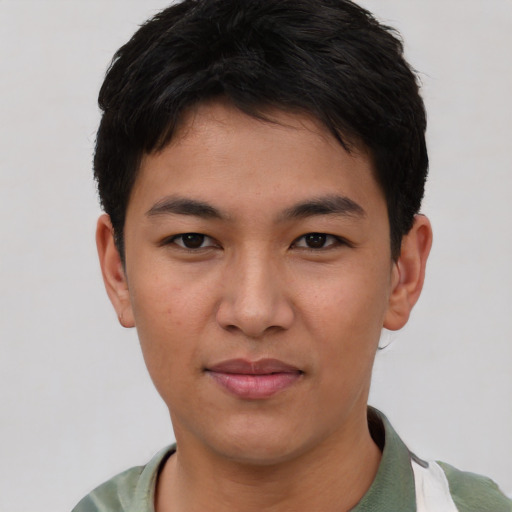 Joyful asian young-adult male with short  brown hair and brown eyes