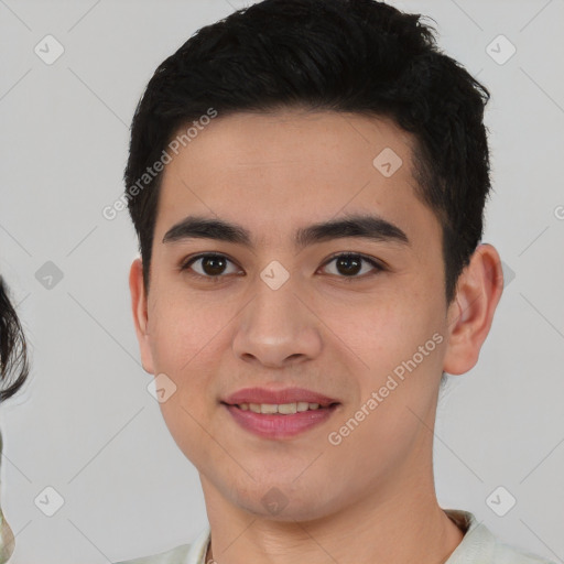 Joyful white young-adult male with short  black hair and brown eyes