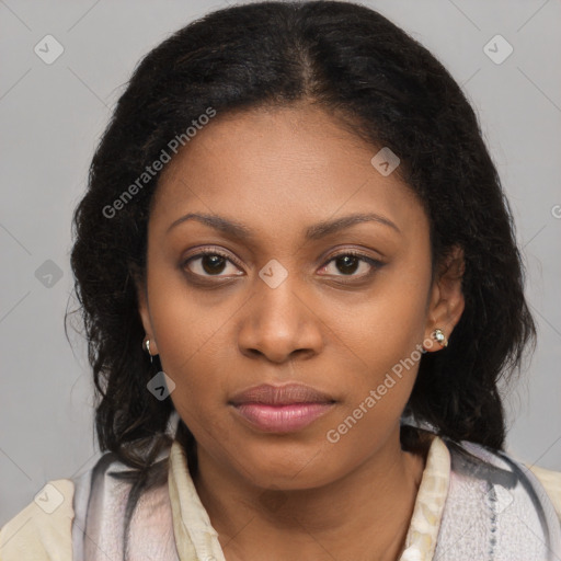 Joyful black young-adult female with long  black hair and brown eyes