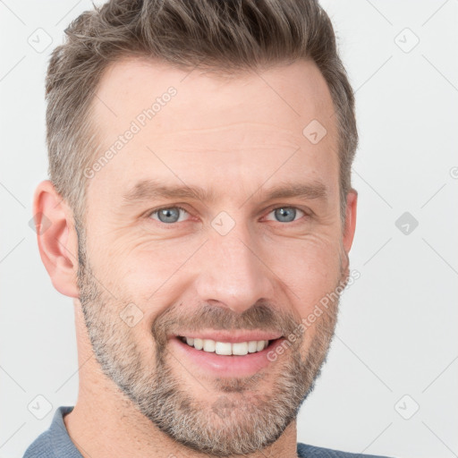 Joyful white adult male with short  brown hair and grey eyes