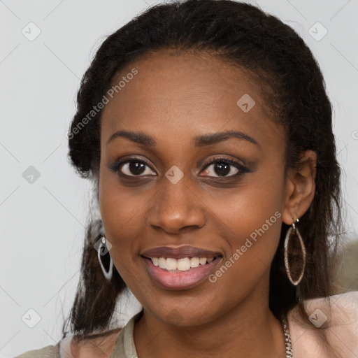 Joyful black young-adult female with long  brown hair and brown eyes