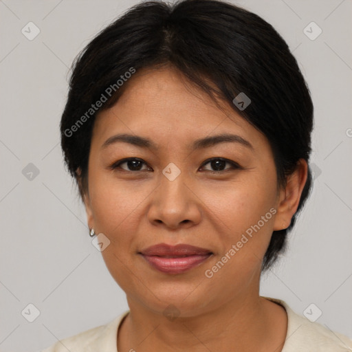 Joyful asian adult female with medium  brown hair and brown eyes