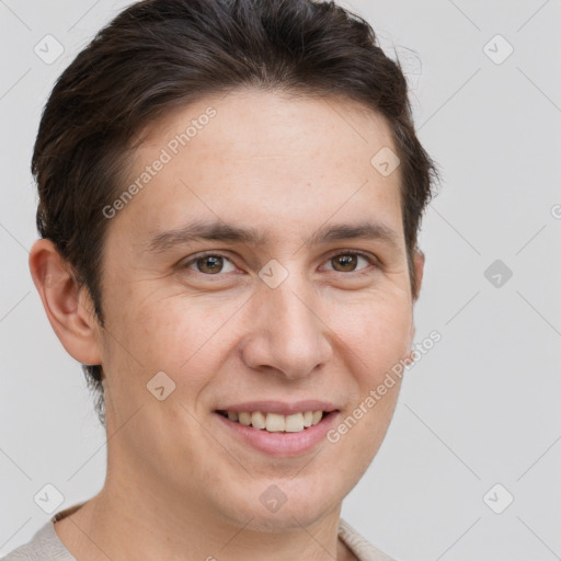 Joyful white adult male with short  brown hair and brown eyes