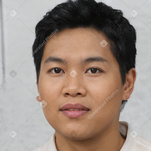 Joyful asian young-adult male with short  black hair and brown eyes