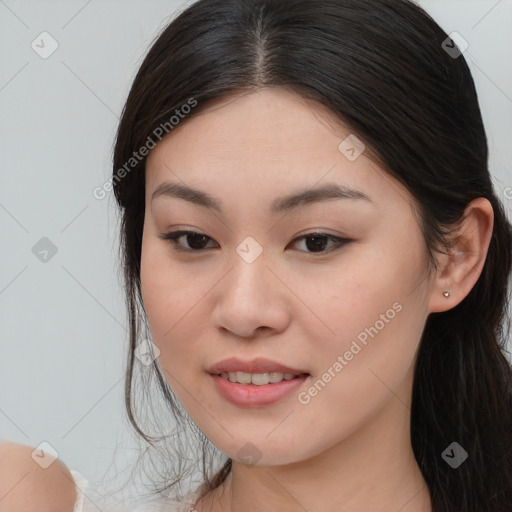 Joyful asian young-adult female with long  brown hair and brown eyes