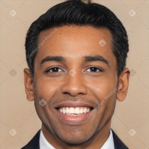 Joyful black young-adult male with short  black hair and brown eyes