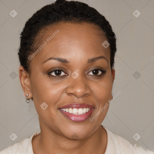 Joyful black young-adult female with short  brown hair and brown eyes