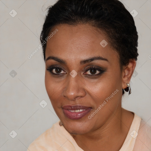 Joyful black young-adult female with short  brown hair and brown eyes