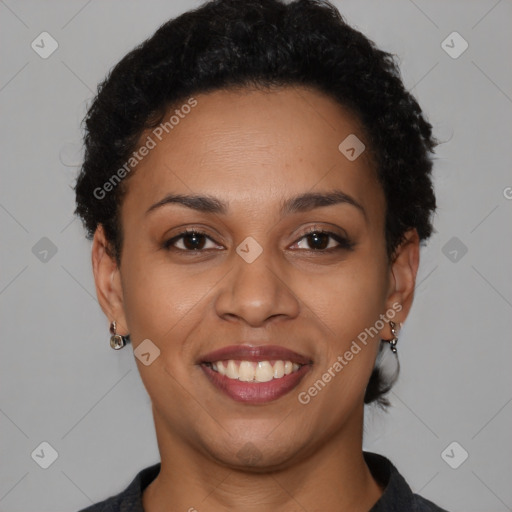 Joyful black young-adult female with short  brown hair and brown eyes