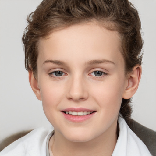 Joyful white child female with short  brown hair and brown eyes