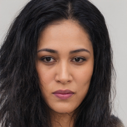 Neutral latino young-adult female with long  brown hair and brown eyes