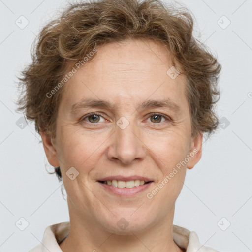 Joyful white adult male with short  brown hair and grey eyes