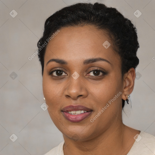 Joyful black young-adult female with short  brown hair and brown eyes