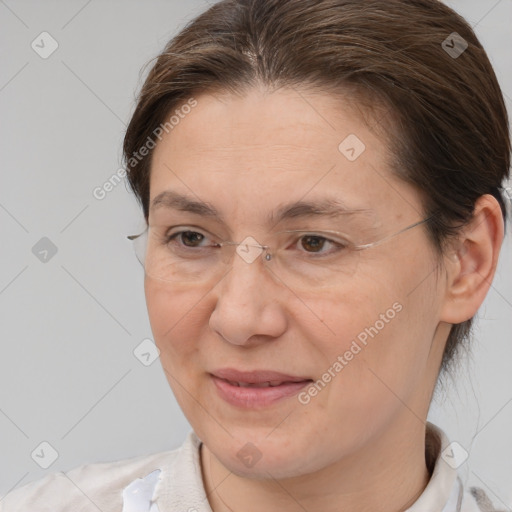 Joyful white adult female with medium  brown hair and brown eyes