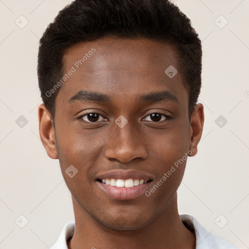 Joyful black young-adult male with short  brown hair and brown eyes