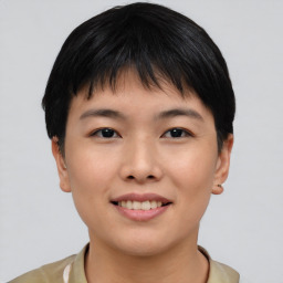 Joyful asian young-adult female with short  black hair and brown eyes