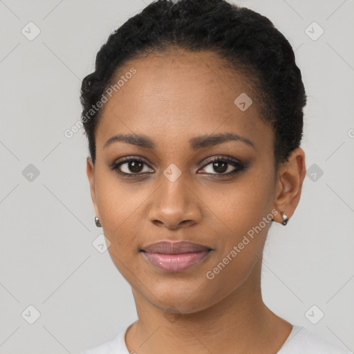 Joyful black young-adult female with short  black hair and brown eyes